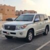 Front view of 2009 Toyota Land Cruiser GXR V8, white exterior, parked in Qatar.