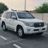 Front view of 2009 Toyota Land Cruiser GXR V8, white exterior, parked in Qatar.