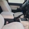 Driver’s seat and dashboard view of the 2009 Toyota Land Cruiser GXR V8, highlighting the clean interior.