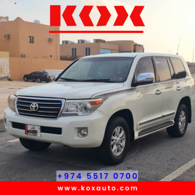 Front view of 2009 Toyota Land Cruiser GXR V8, white exterior, parked in Qatar.